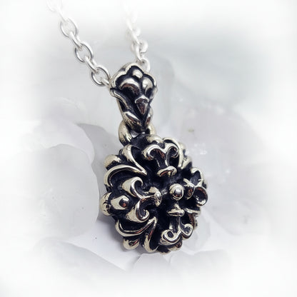 This Melodic Cross Pendant