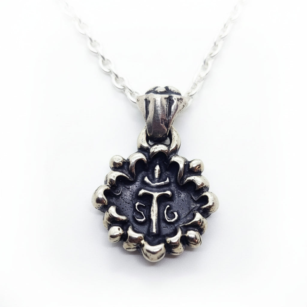 This Melodic Cross Pendant